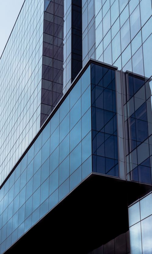 Free Contemporary multistory business center with square ornament on front wall in town in daylight Stock Photo