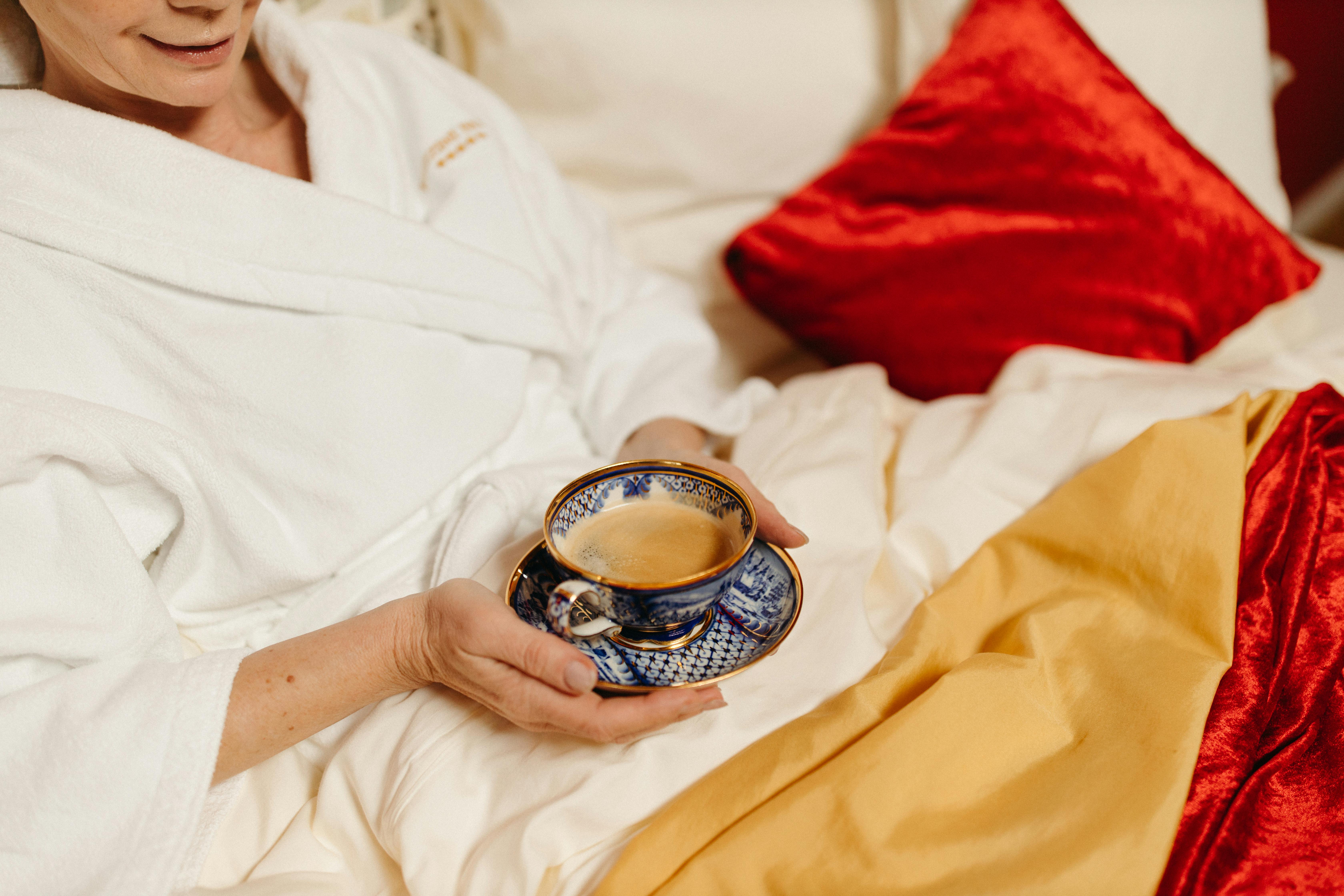 person holding cup of coffee