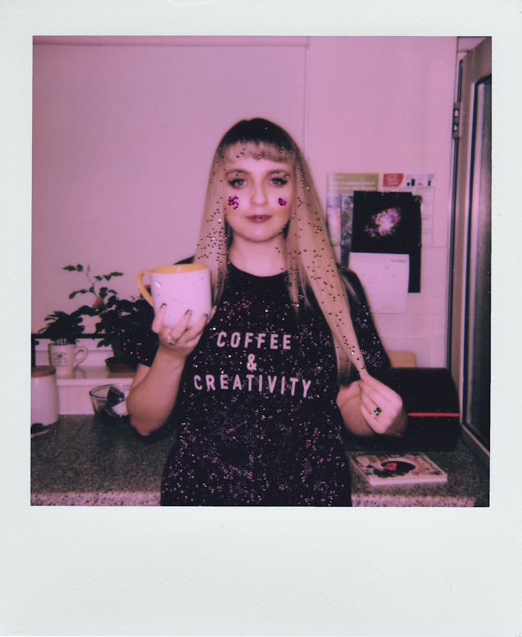 Polaroid Photo Of A Woman With A Mug Of Coffee