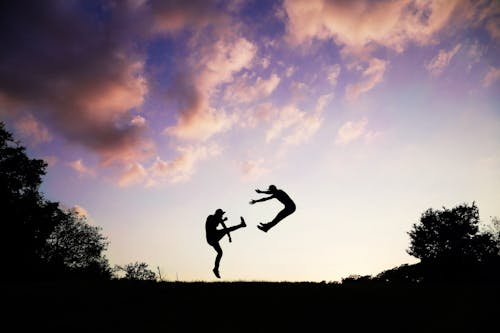 2 People Doing Karate during Sunset