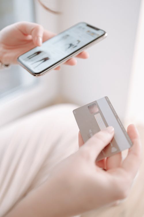 Person Holding a Credit Card