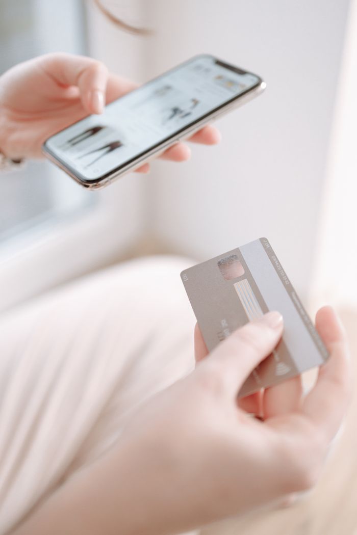 Hand holding a payment card