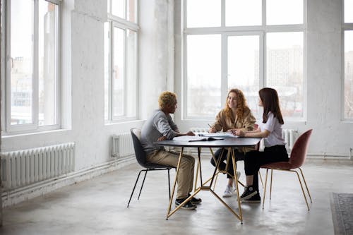 Positive diverse students studying in modern classroom