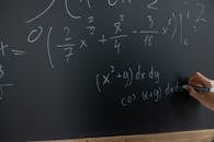 Mathematical Equation Written On Blackboard