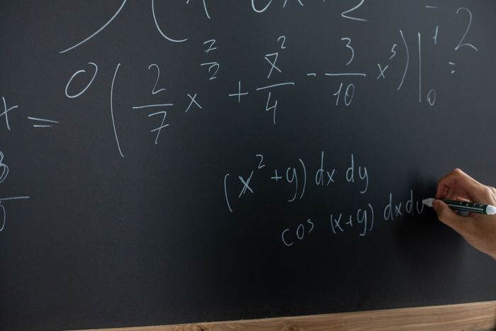 Equations written on a chalkboard
