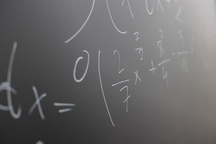 Worked example written on a chalkboard