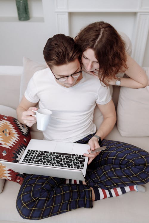 Free Man and Woman Looking at a Computer Screen Stock Photo