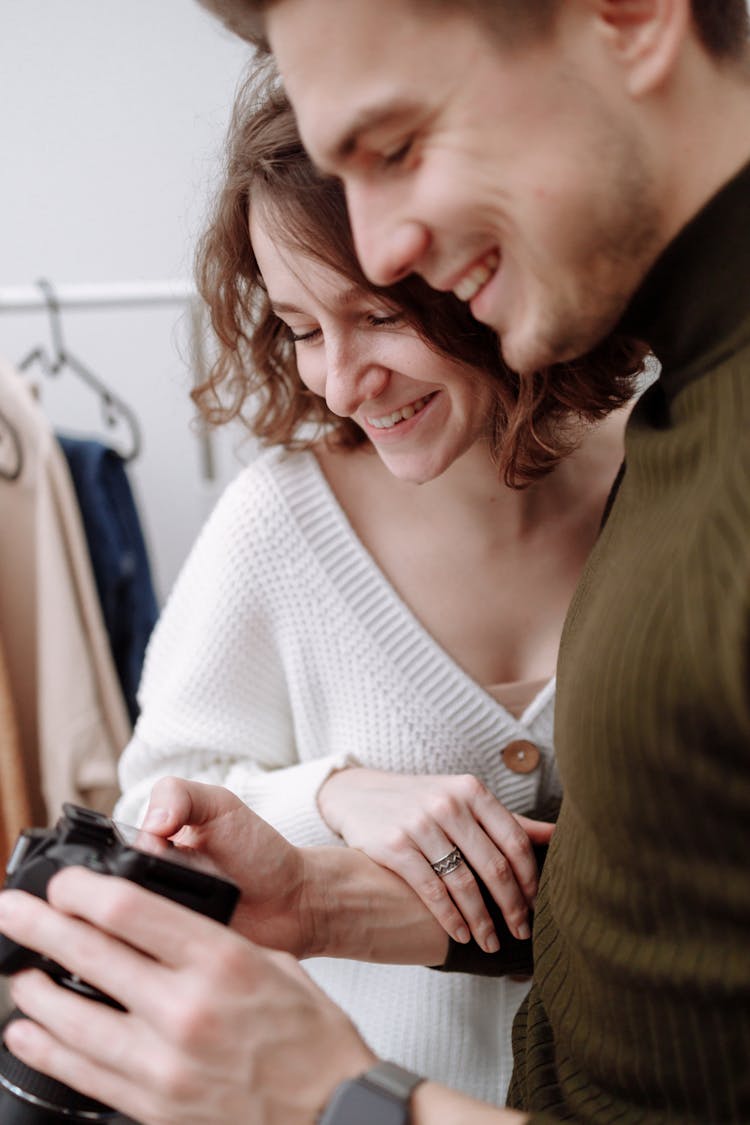 Couple Looking At The Camera Smiling