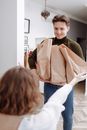 Man Carrying Paper Bags