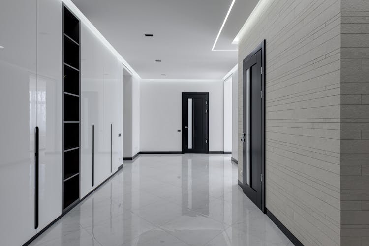 Big Hall In Minimalistic Style In Modern Apartment Building