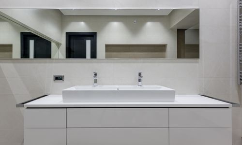Modern bathroom with vessel sink and towel warmer