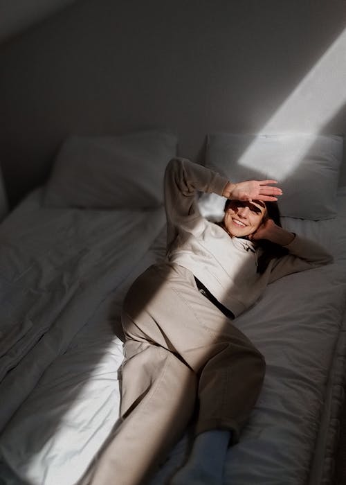 Woman Lying on Bed