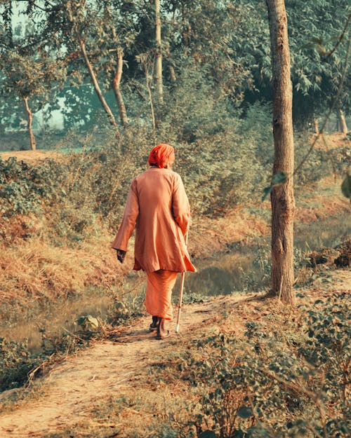 Person Walking on a Path in the Woods