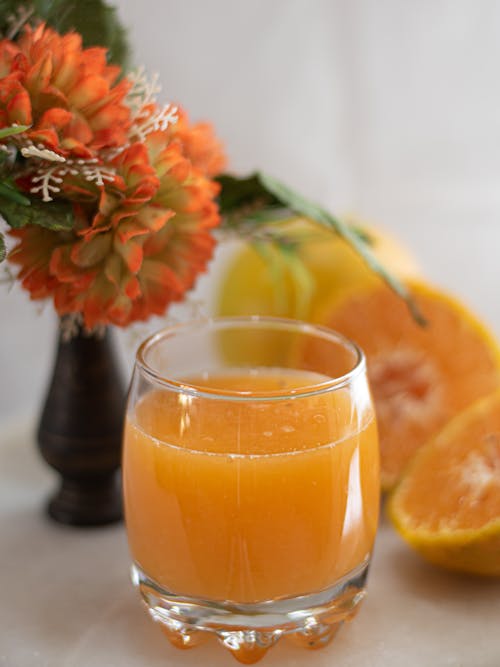 Free Fresh Orange Juice in Clear Drinking Glass Stock Photo