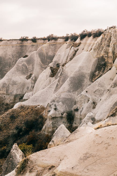 Huge rocky ravine under cloudy sky