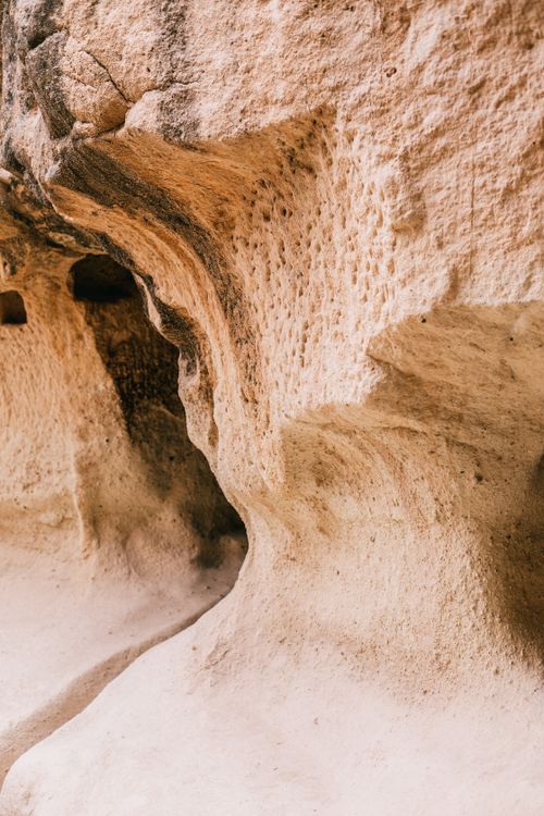 Free Rocky uneven mountains with rough sandy texture and dry massive surface in daylight Stock Photo