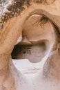 Empty soundless untouched stony cave of dry desert in daytime in wild nature