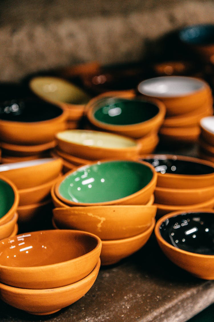 Colorful Ceramic Bowls Placed On Shelf For Sale