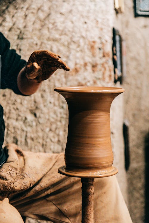 Professional master creating handmade clay pot