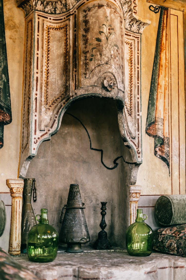 Vintage Bottles And Incense Burner On Stone Surface