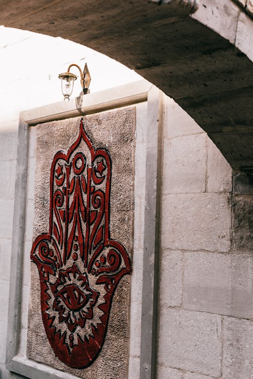 Hamsa hand on stone wall