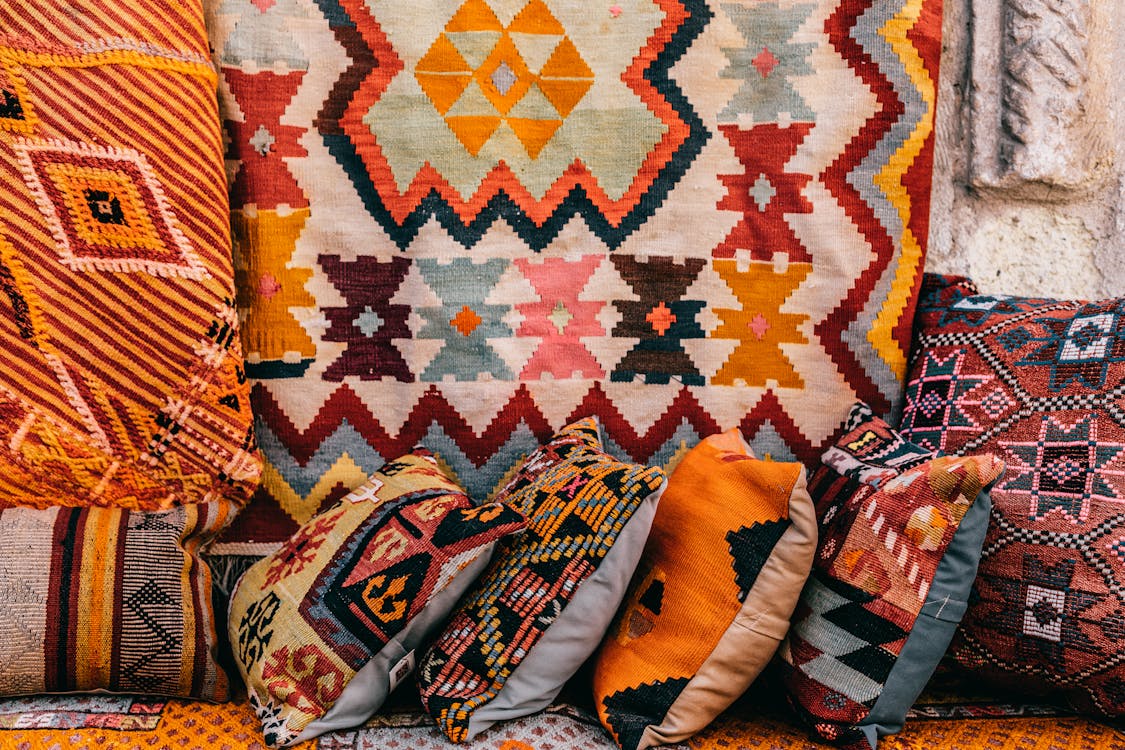 Bright cushions on market in street