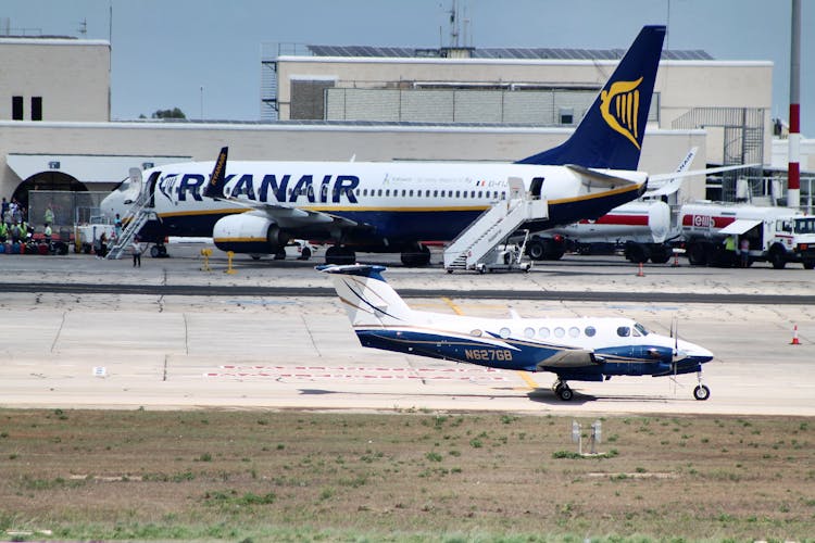 Various Modern Airliners Parked On Runway Of Airport