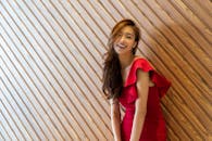 Photo of a Beautiful Woman in a Red Dress Smiling