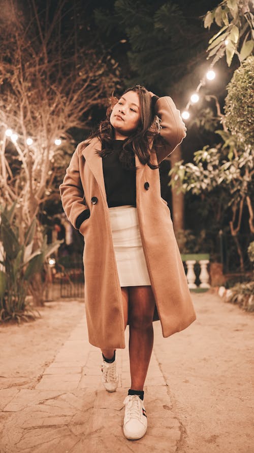 Free Photo of a Woman in a Brown Coat Walking Stock Photo