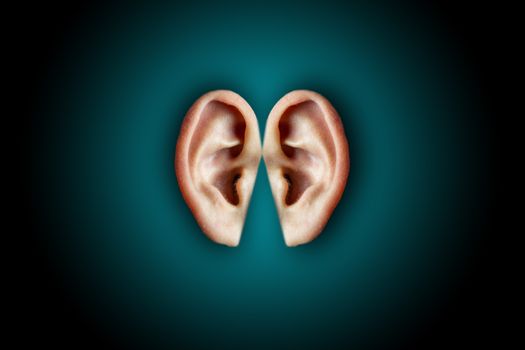 Creative shot of human ears on dark background