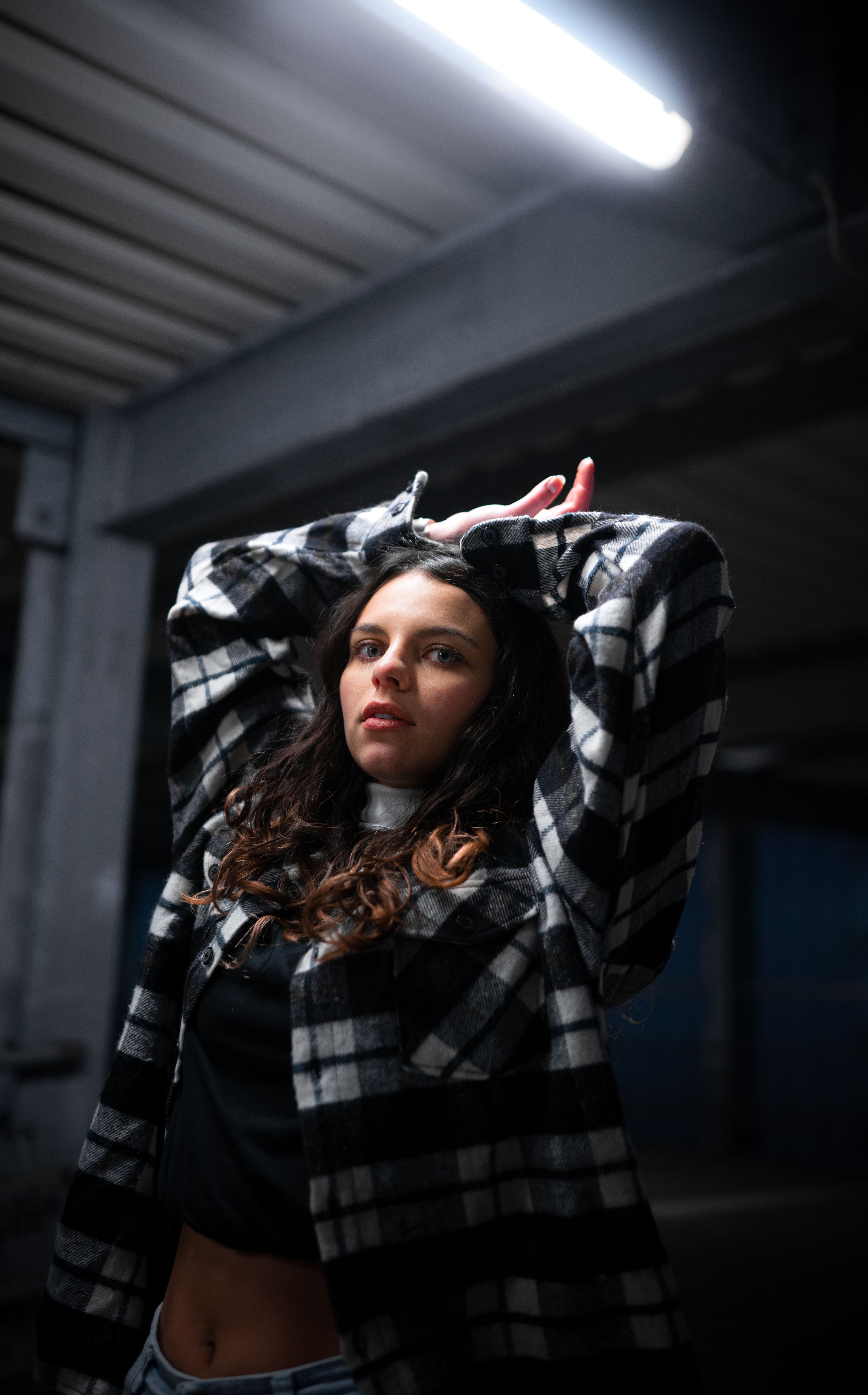 A Woman at the Beach Posing with Her Hand on Her Head · Free Stock Photo