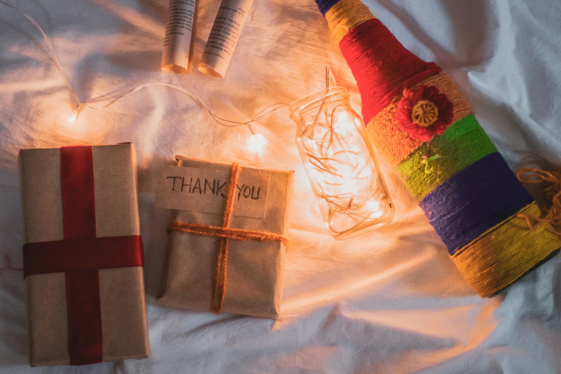 Handmade decor with wrapped gifts and fairy lights creating a cozy festive atmosphere.