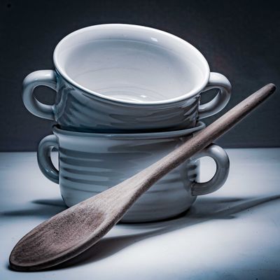 Stacked stoneware bowls with a wooden spoon — Bill Bistak on Pexels