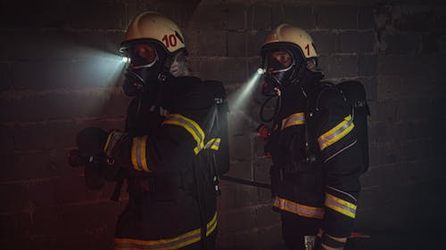Photograph of Firefighters with Flashlights on their Helmets