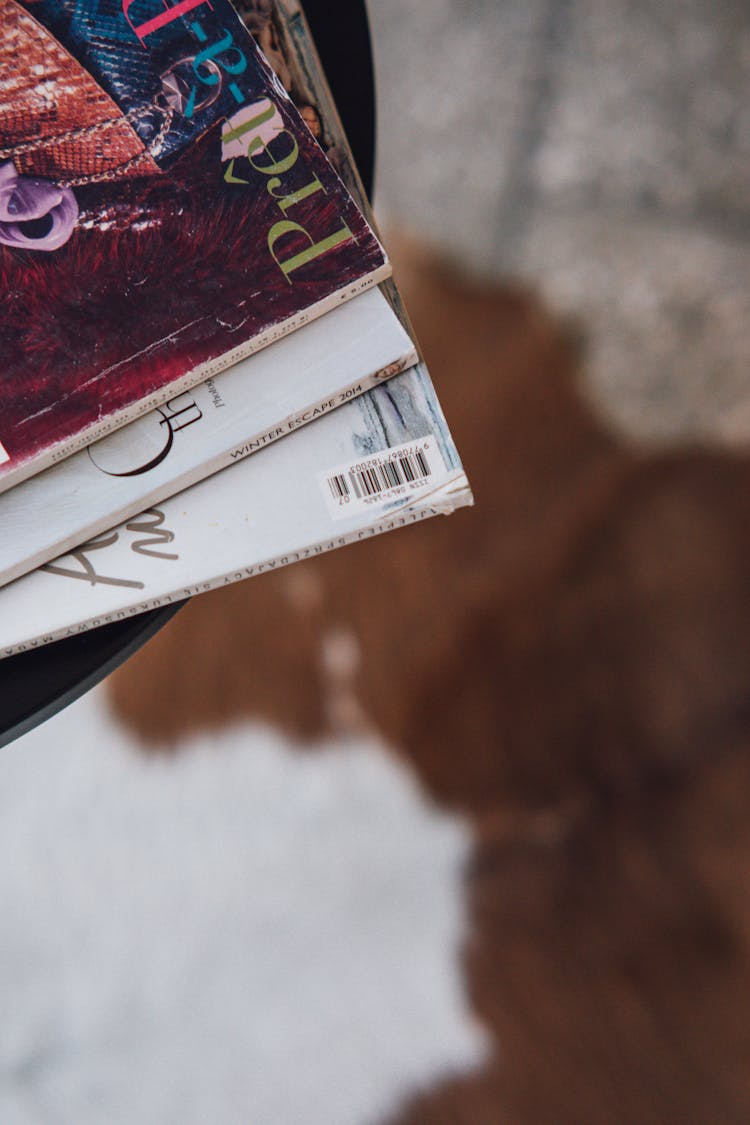 Selective Focus Photograph Of A Stack Of Magazines