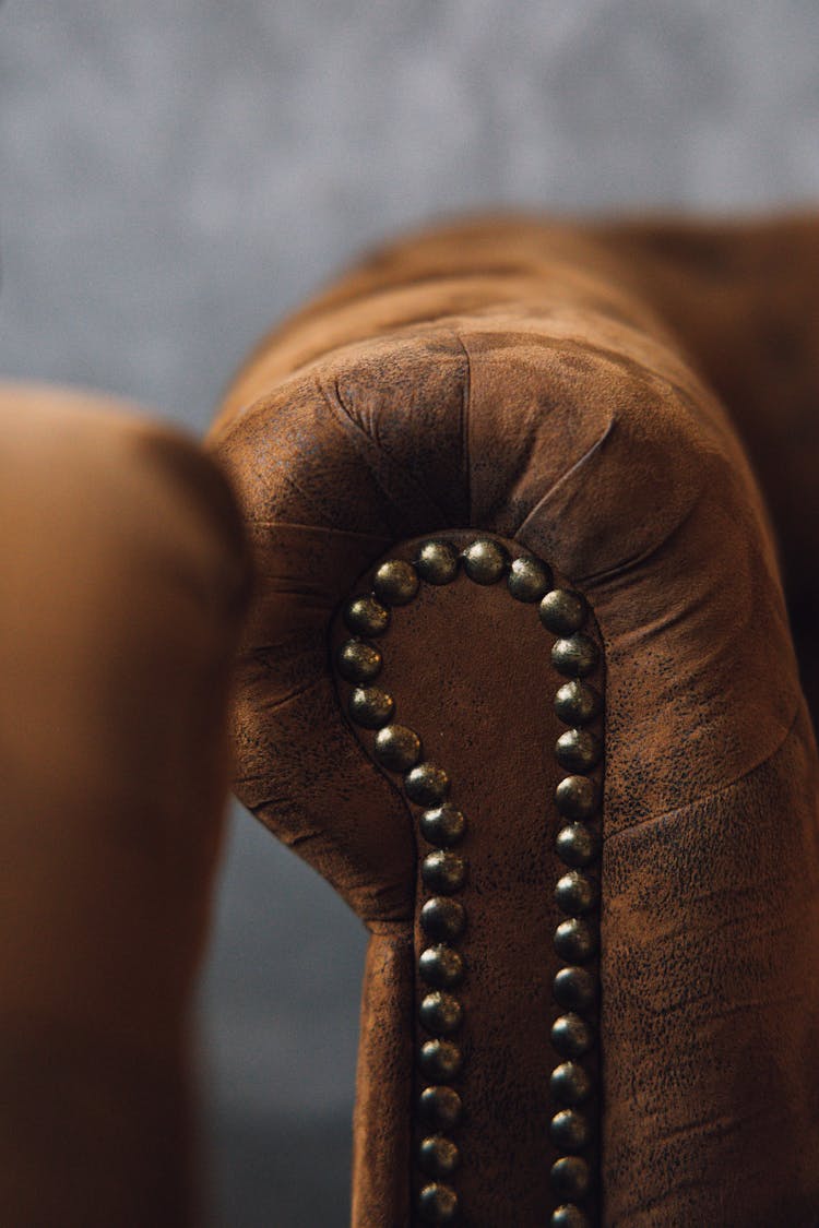 Pinned Brass Buttons In An Armchair 