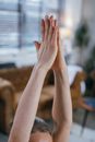 Photo of a Person's Hands Together while Doing Yoga