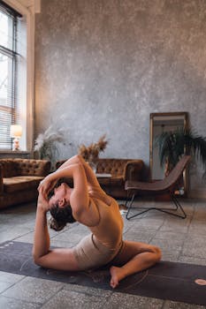 Woman practicing yoga pose at home, showcasing flexibility and tranquility.