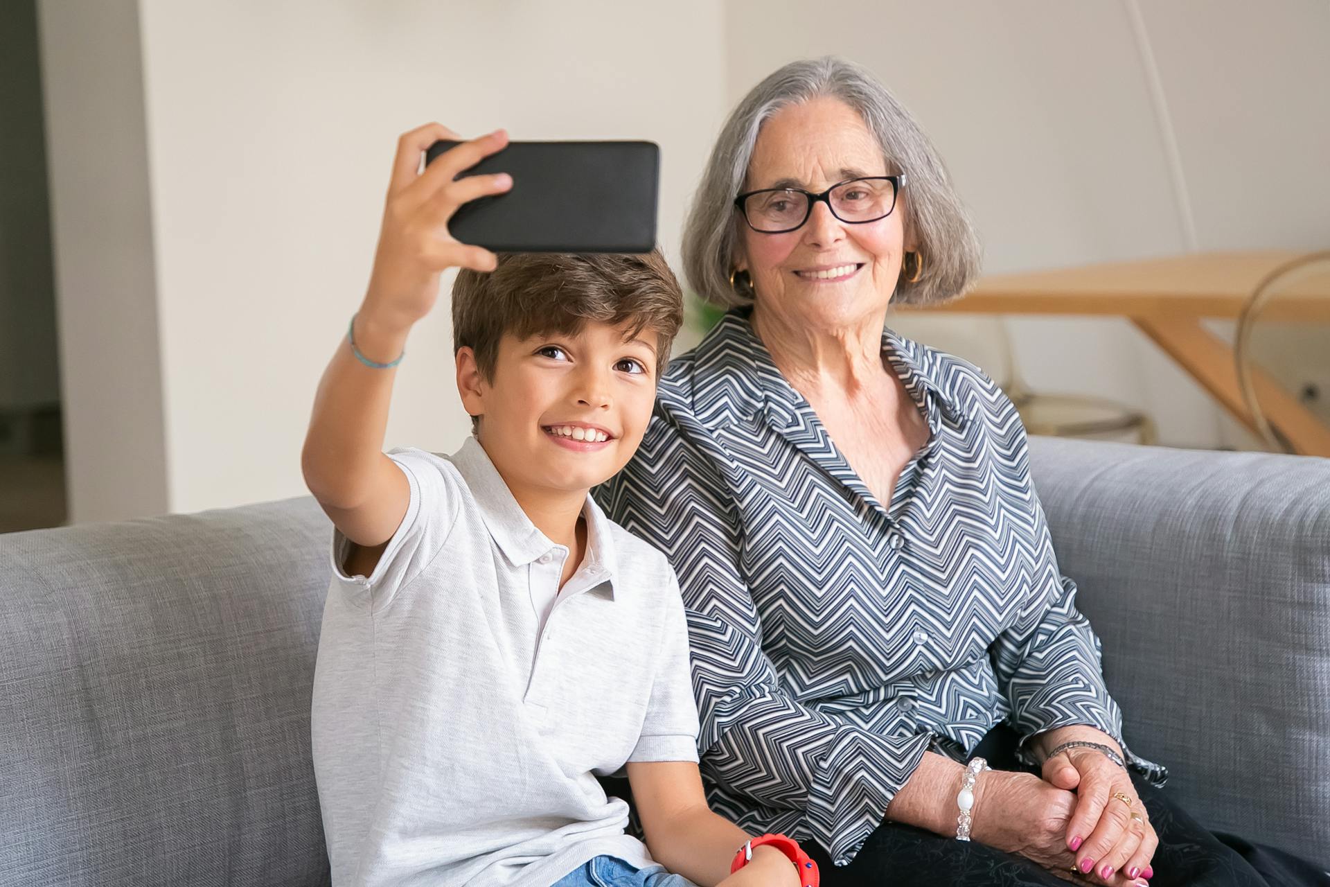Grandchild Taking a Photo with his Grandma