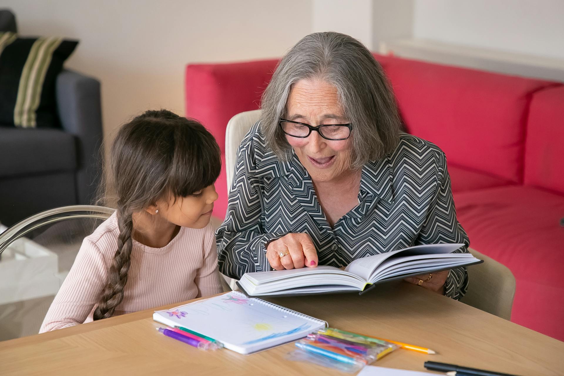 Grandmother Helping her Grandchildren with her Studies