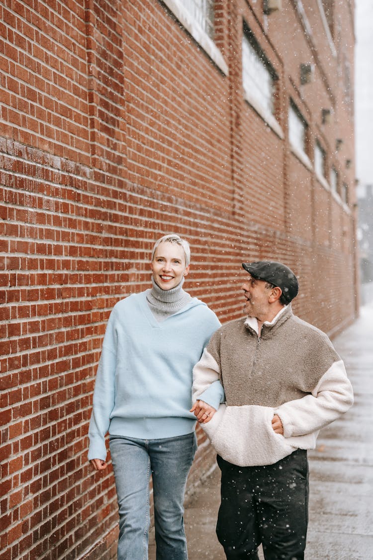 Diverse Couple Walking On Street In Daytime