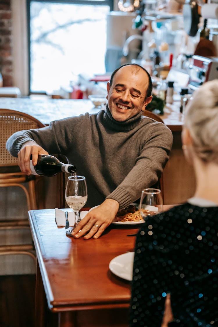 Smiling Couple Having Dinner With Pasta And Wine In Room