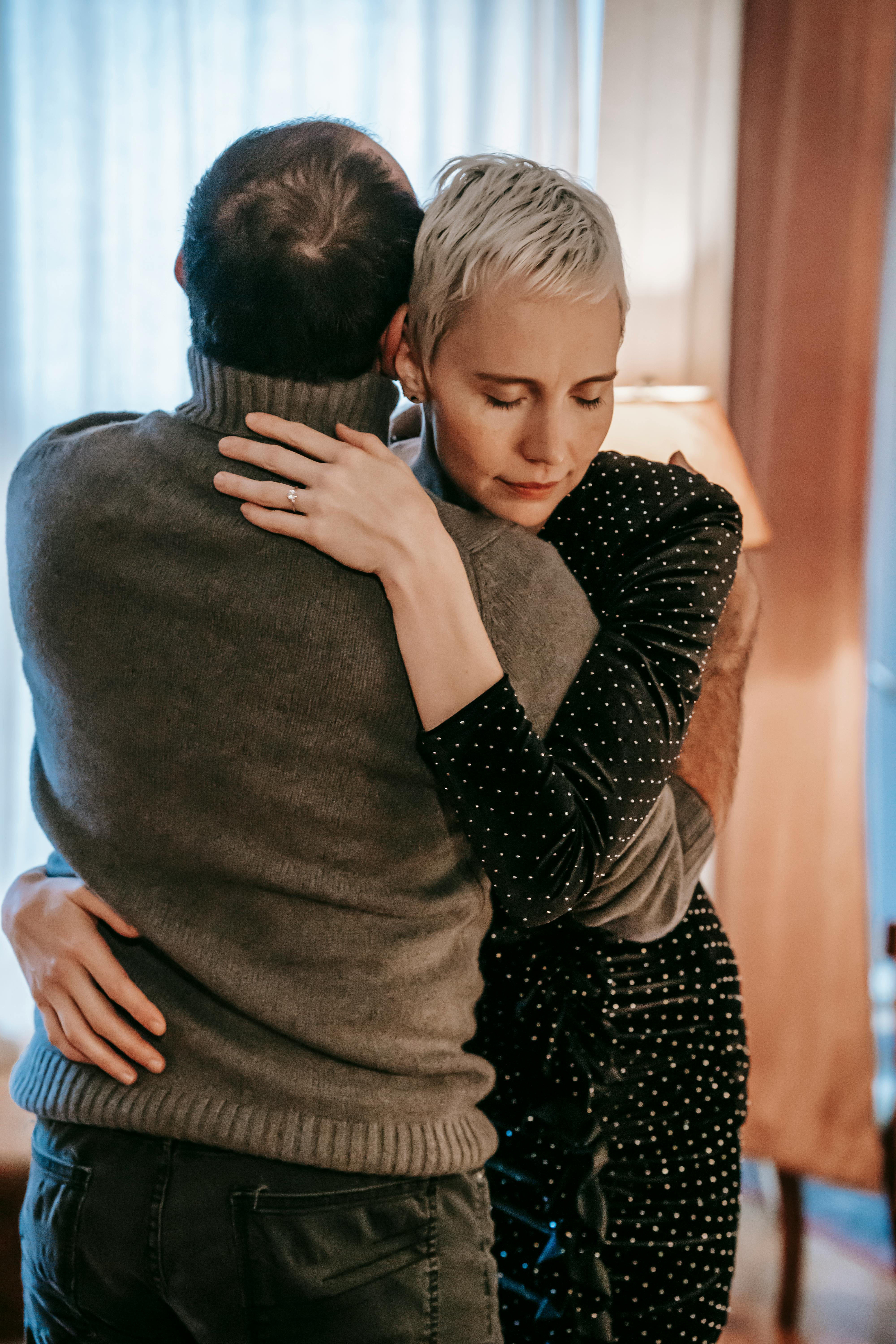 cheerful couple having romantic moment while hugging together