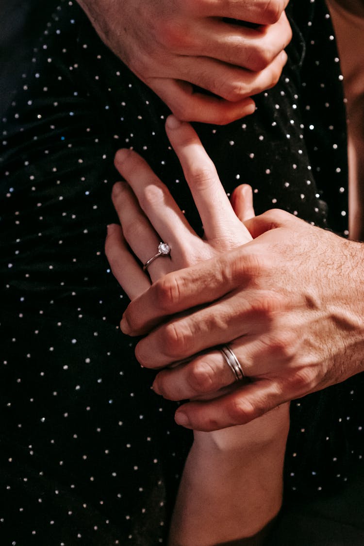 Gentle Married Couple In Rings Hugging Gently