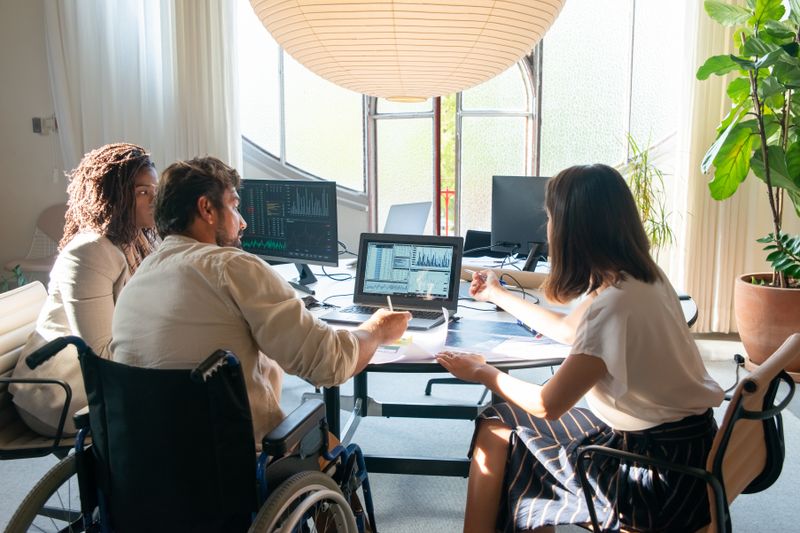 A professional consultant meeting with a client to discuss their person-centered plan