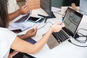 Marketing team comparing data and strategic options