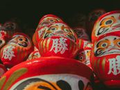 Traditional daruma dolls on market