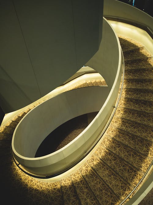 Spiral staircase with ornamental elements in light