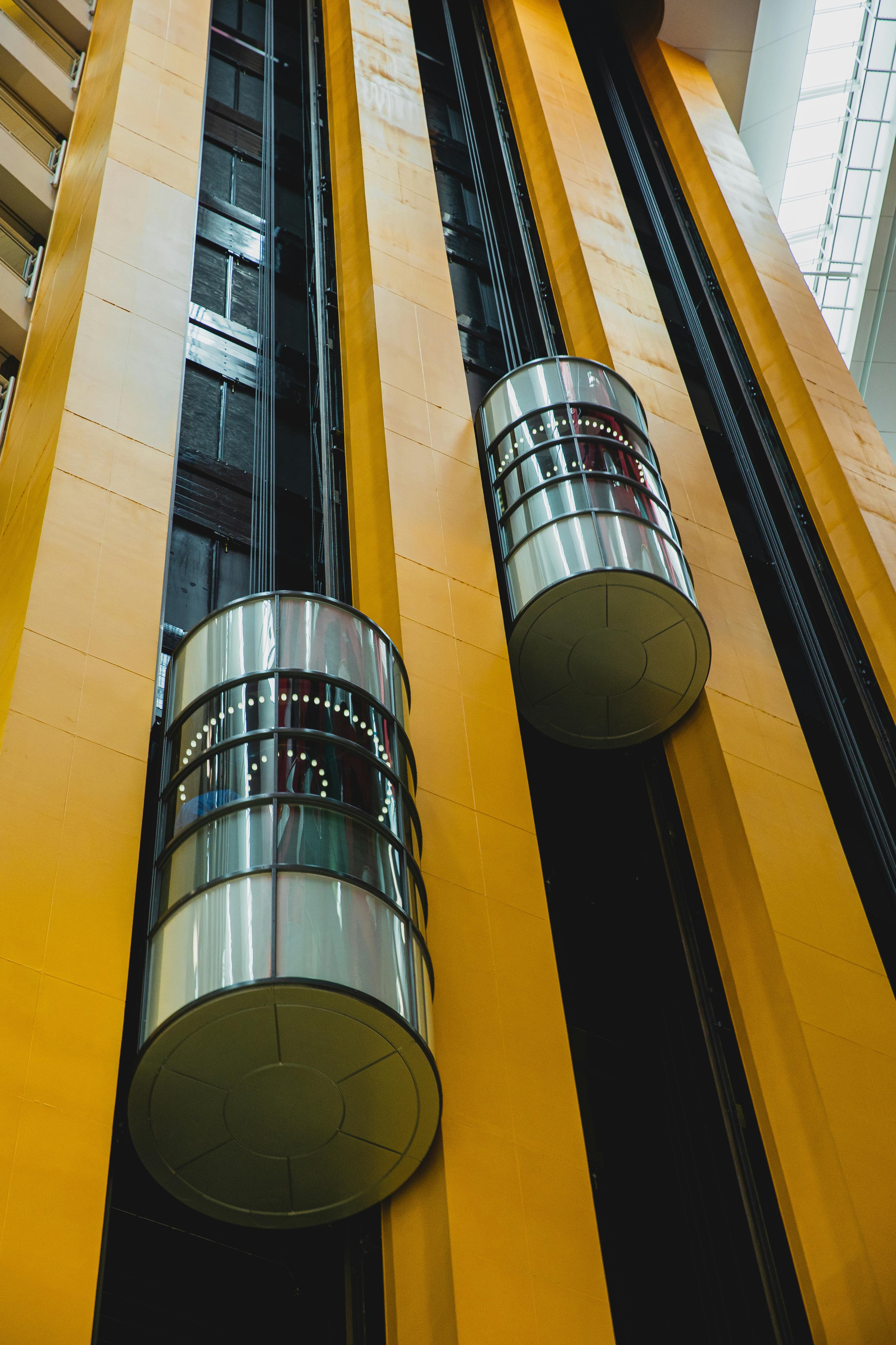 modern geometric building with moving elevators