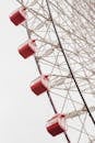 Ferris wheel with passenger cabins in amusement park